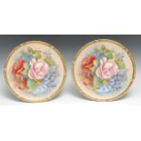 A pair of Aynsley circular cabinet plates, decorated by J.A.Bailey, signed with rose, violets,