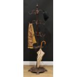 An early 20th century cast iron hat and coat stand, the base with provision for walking sticks or
