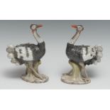 A pair of Continental porcelain models, of ostriches, modelled and painted in naturalistic tones,