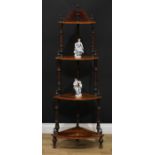 A Victorian walnut and marquetry four-tier corner whatnot, each plateau inlaid with a shell and