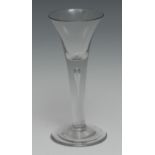 A George II trumpet shaped wine glass, drawn stem with teardrop inclusion, domed foot, pontil