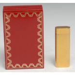 A Cartier Briquets gold plated cigarette lighter, 7cm long, no. 33082, certificate, boxed