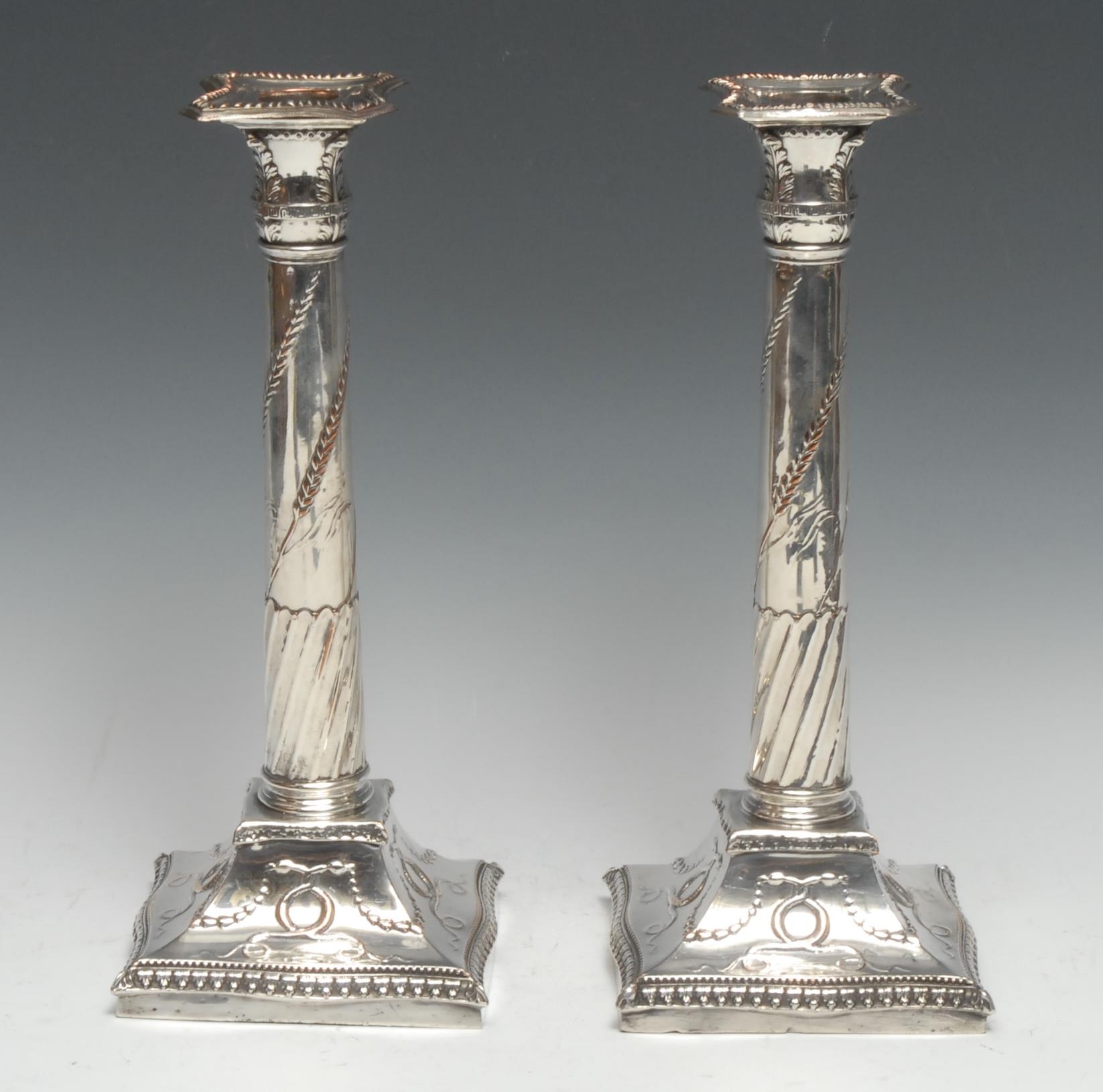 A pair of George III Old Sheffield Plate table candlesticks, of Adam design, incurved canted - Image 2 of 2