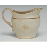 A Pinxton straight fluted flattened ovoid jug, decorated in gilt with sprigs, 10cm high, c.1800