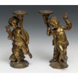 A pair of 19th Century gilt bronze table lights as dancing scantily clad Bacchic infants wearing