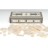 A collection of Chinese mother of pearl gaming counters, each engraved in the typical Cantonese