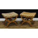 A pair of Italian Baroque design giltwood X-frame stools, each with stuffed-over rectangular seat,