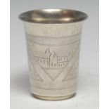 A Russian silver flared cylindrical beaker, engraved with landscape vignettes and stiff leaves