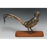 An Elizabeth II silver gilt table decoration, as a pheasant, glass eyes, 36cm long, London 1974,