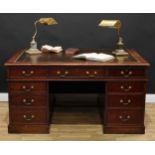 A Victorian mahogany twin pedestal partners' desk, rectangular top with tooled and gilt writing
