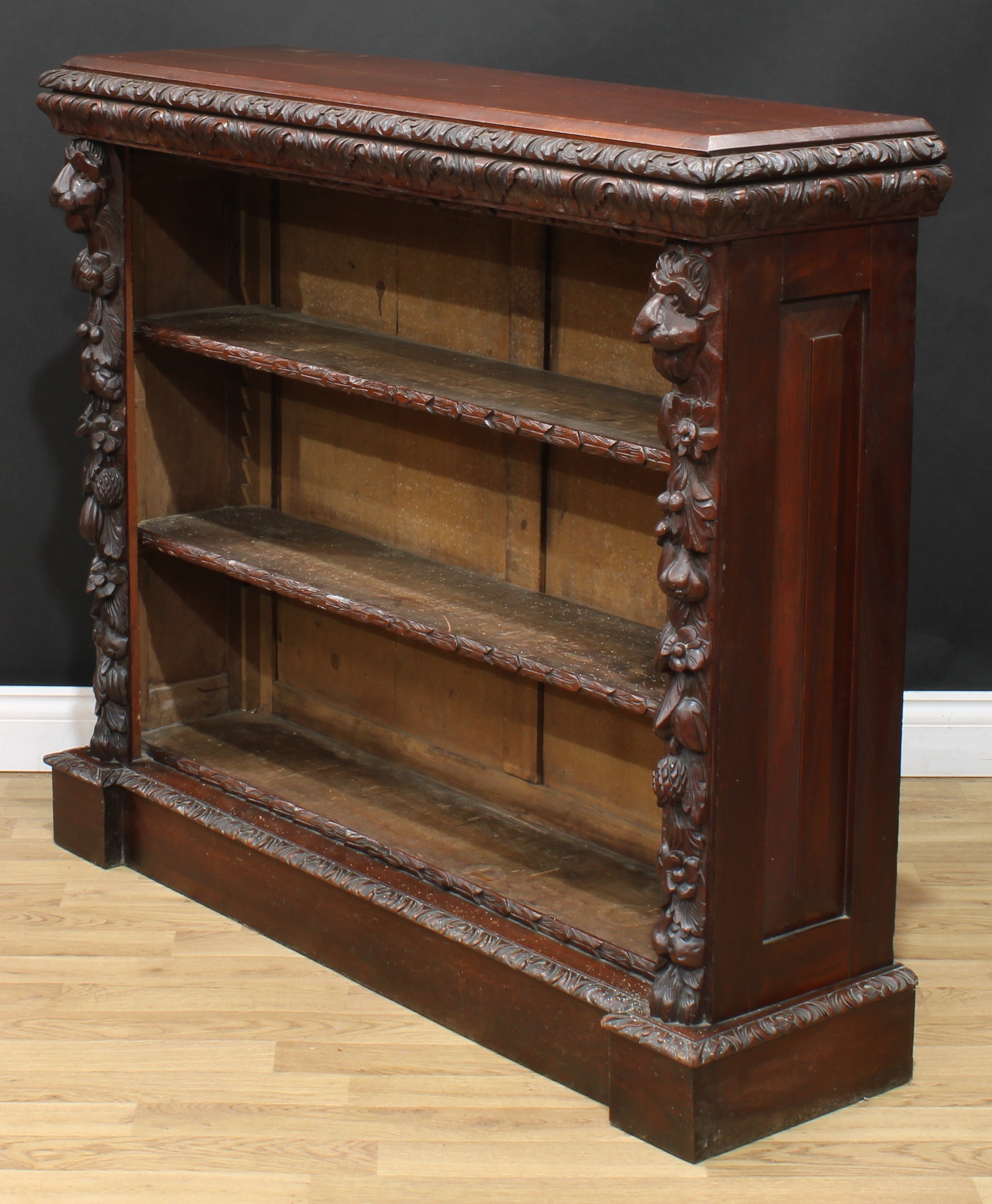 A late Victorian oak library open bookcase, rectangular top with leafy moulded edge above two - Image 4 of 5