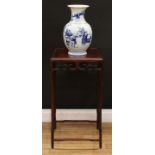 A Chinese hardwood jardiniere stand, panel top above a deep frieze pierced and carved with