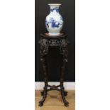 A Chinese hardwood octagonal vase or jardiniere stand, beaded top with inset soapstone panel above a