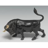 An Austrian cold painted bronze, of a bull, 15cm long, marked Geschutzt, Vienna, c.1900