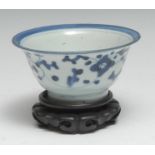 A Chinese porcelain flared cylindrical bowl, painted with flowering leafy stems between graduating