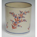 A Pinxton porter mug, enamelled in and blue and red spray and scattered sprigs, blue rim, 11cm high,