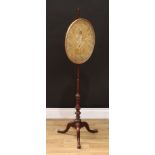 A George III mahogany tripod pole screen, the oval banner with a silk picture, depicting a maenad