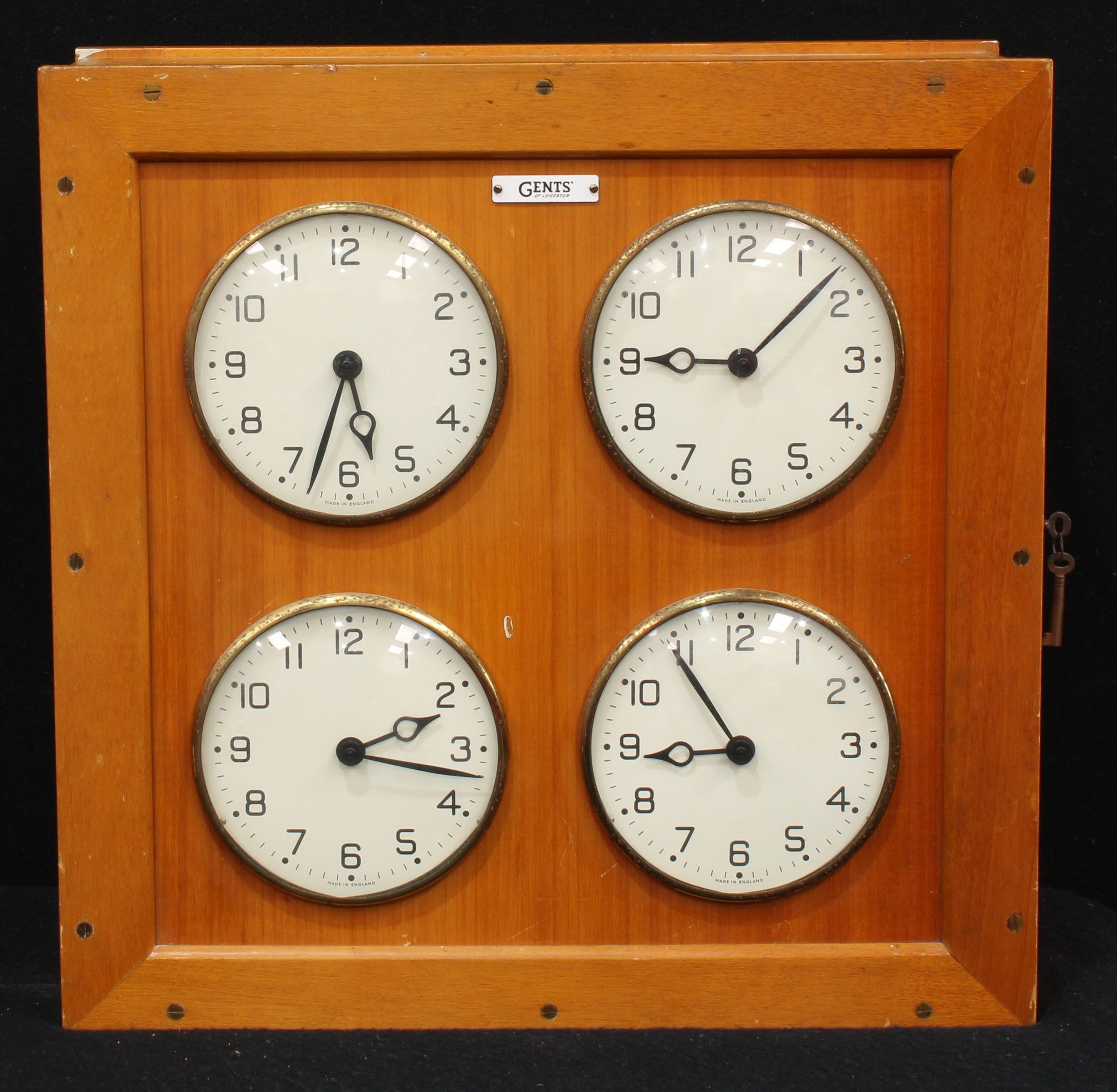 A mid-20th century electric four dial bank or factory clock, by Gents of Leicester, each 14.5cm