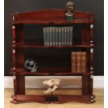 A set of 19th century mahogany wall hanging waterfall collector's shelves, shaped serpentine shelves