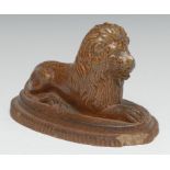 A 19th century salt glazed stoneware model, of a recumbent lion, shaped oval base, 16.5cm long
