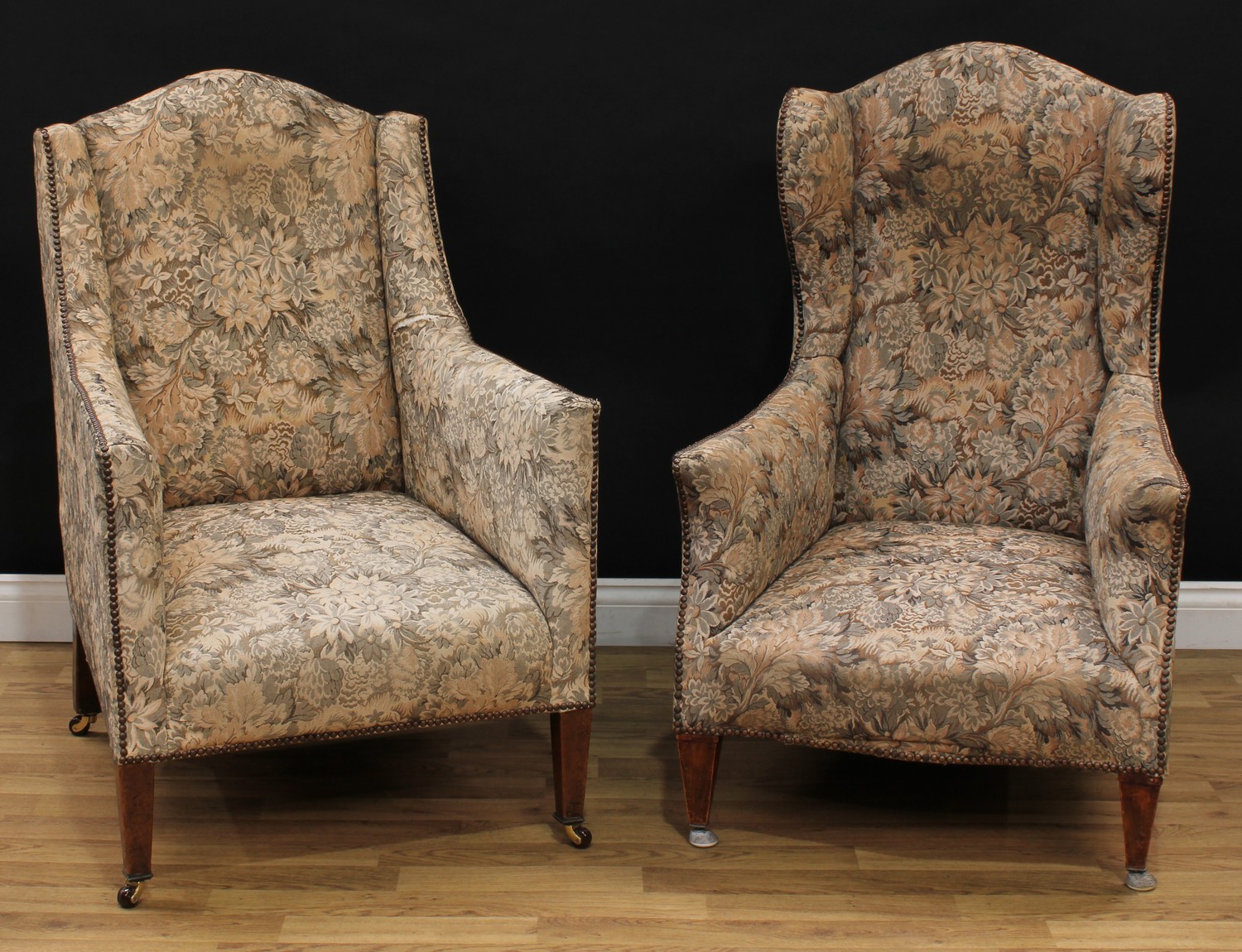 An associated pair of early 20th century drawing room chairs, stuffed-over studded border