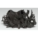 A Chinese bronze scholar's brush stand, cast as a root and blossoming prunus, 17cm wide, 19th