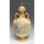 A Royal Worcester two handled pedestal ovoid vase, printed and painted with blue blossom and foliage
