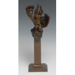 An Art Nouveau style brown patinated desk bronze, of a putto reaching skyward, stepped square