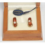 A pair of limited edition Faberge diamond set 18ct gold red enamelled half hoop earrings, the red