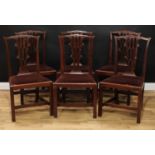 A set of six Chippendale Revival mahogany dining chairs, each with a shaped cresting rail above a