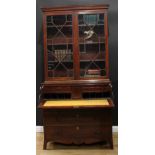 A George III mahogany secretaire bookcase, the associated top with moulded outswept cornice above