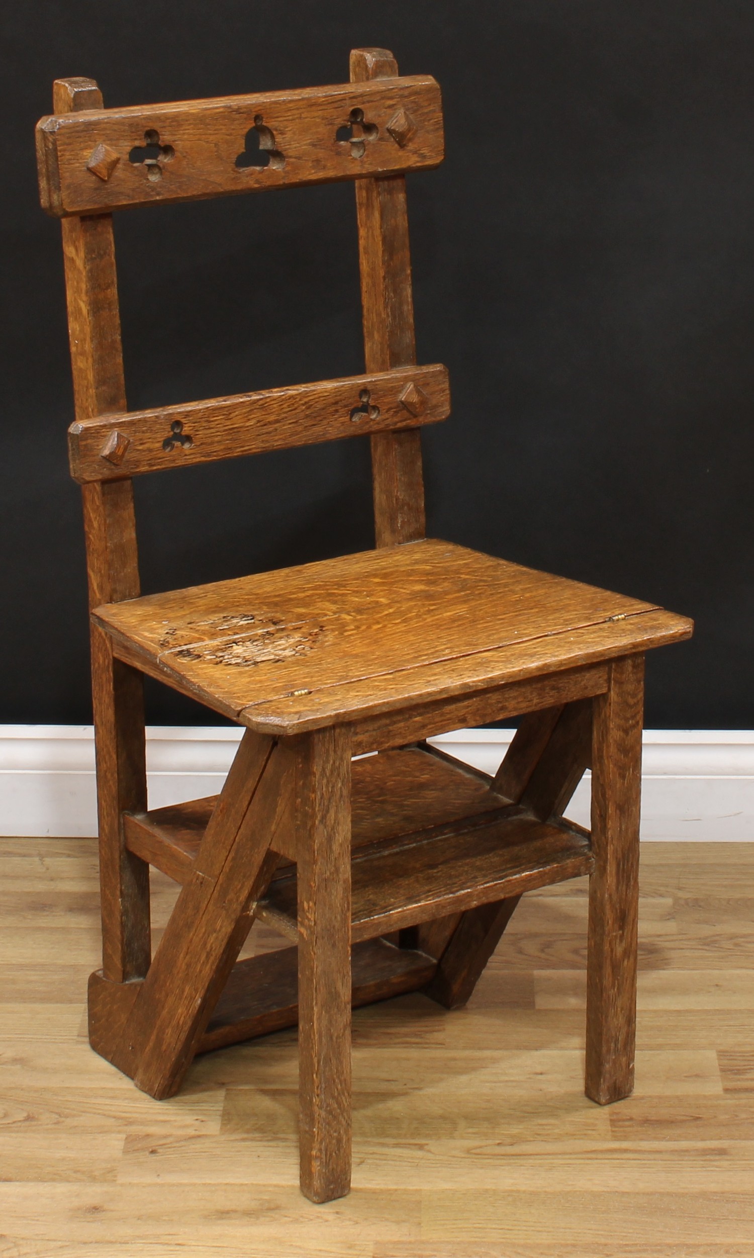 A Victorian Gothic Revival oak metamorphic chair, converting to library steps, rectangular