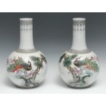 A pair of Chinese Republic ovoid vases, decorated with peacocks and verse, 29.5cm high, red seal