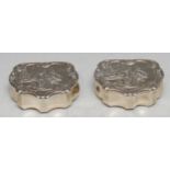 A pair of unusual Victorian silver commode shaped vesta boxes, hinged covers chased with scenes