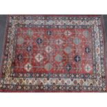 A Middle Eastern woollen carpet, worked in the traditional manner, 188cm x 154cm