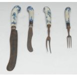 A Bow knife and two pronged fork, the pistol grip hafts painted in underglaze blue with foliate