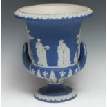 A large Wedgwood blue Jasperware campana vase, typically sprigged in white with classical figures,