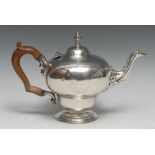 A George/William IV Rococo Revival silver inverted pear shaped teapot, hinged domed cover with