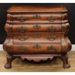A late 18th century Dutch oak bombe shaped chest, canted rectangular top with moulded edge above