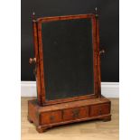 A George II walnut dressing mirror, turned finials, bevelled rectangular plate, the base with