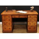 A Victorian burr walnut partner's desk, rounded rectangular top with inset tooled and gilt leather