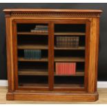 A Victorian walnut and mahogany bookcase, moulded top above a meandrous parquetry frieze and a