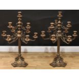 A pair of substantial Empire style bronze ten-light table candelabra, beaded campana sconces, the