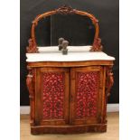 A Victorian walnut side cabinet, the mirrored superstructure frame carved with flowers and