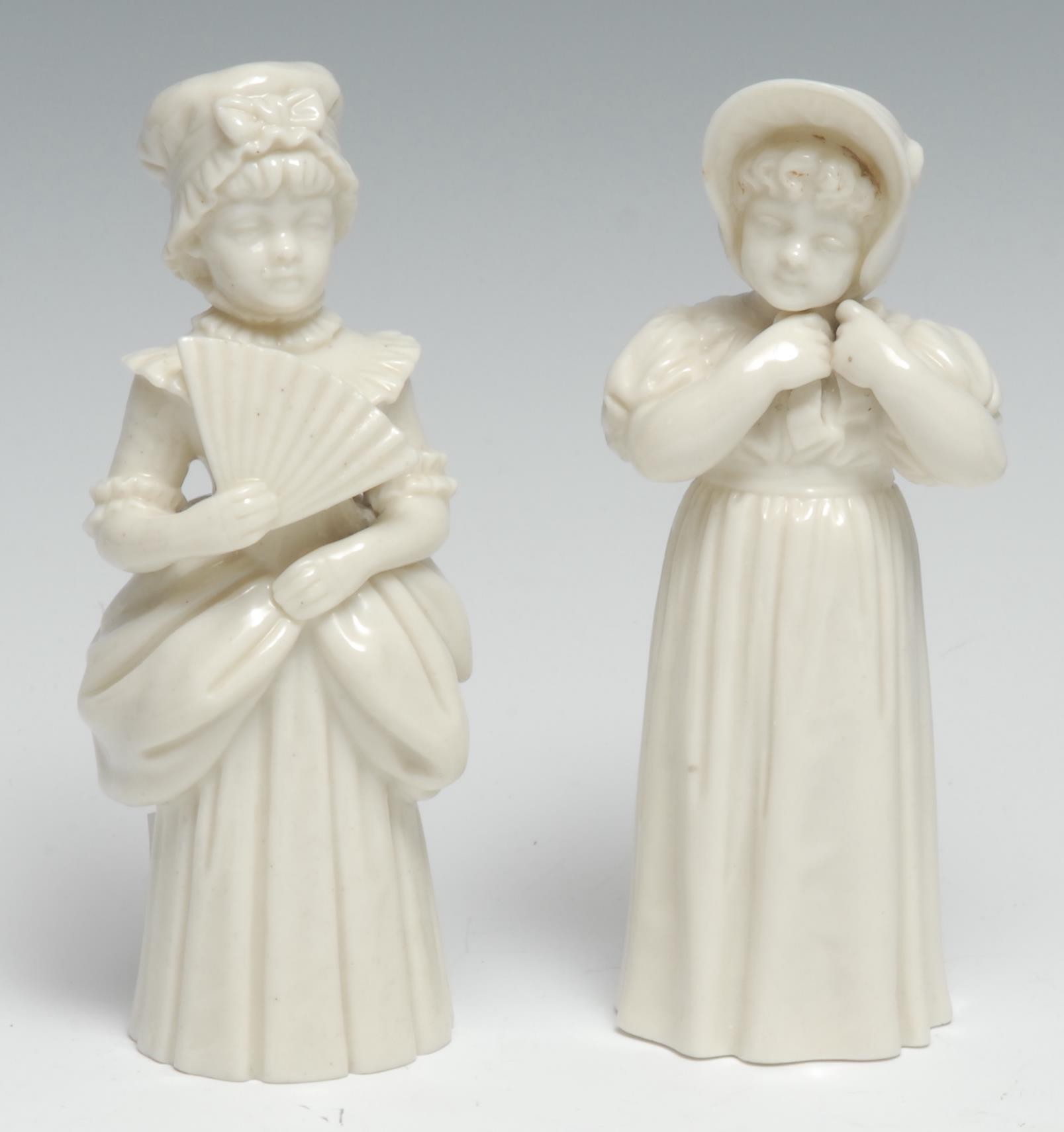 A Royal Worcester candlesnuffer, of Town Girl with a fan, 13.5cm high, crown and circle mark,