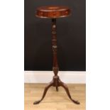 A 19th century mahogany pedestal drum work table, circular top inlaid with a bat wing patera,