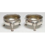 Hester Bateman - a pair of George III silver cauldron salts, shaped everted rim, hoof feet with