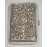 A Thai silver rounded rectangular cigarette case, hinged cover chased with Phra Mae Thorani