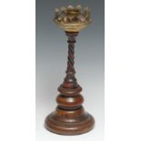 A 19th century walnut, wrought iron and brass candlestick, cylindrical scronce and broad drip pan