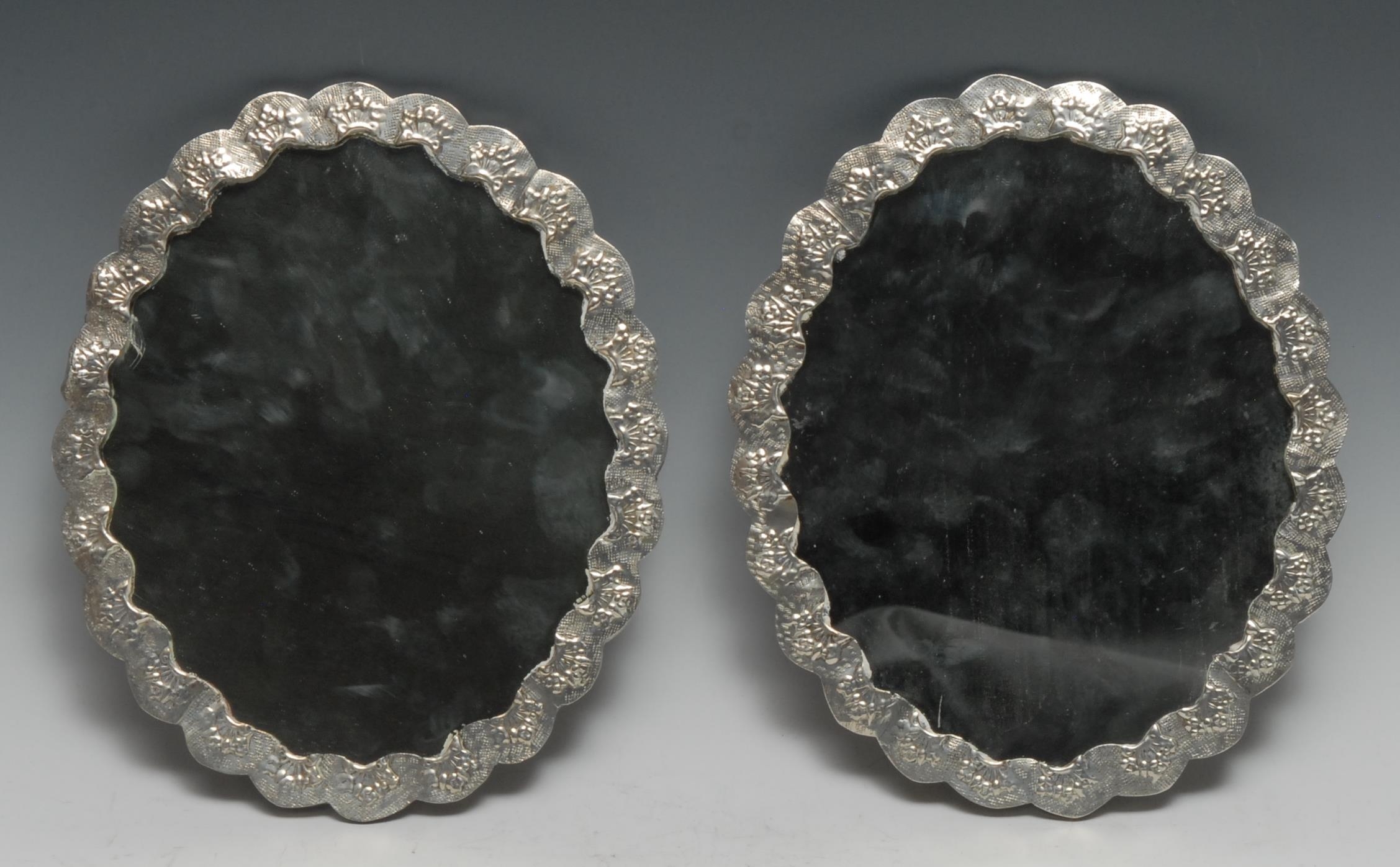 A pair of Turkish silver shaped oval mirrors, chased with flowers and applied with peacocks, 22cm - Image 2 of 4